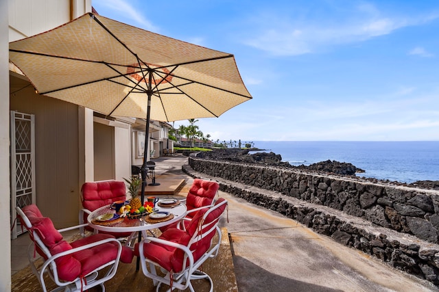 view of patio / terrace with a water view