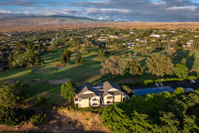 birds eye view of property with a mountain view