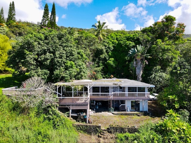 back of property featuring a deck