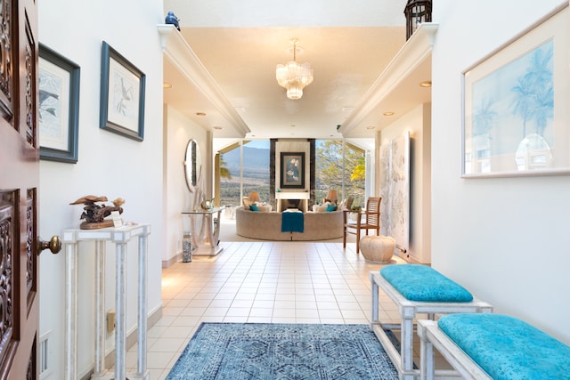 hallway featuring floor to ceiling windows, a chandelier, light tile patterned floors, and crown molding