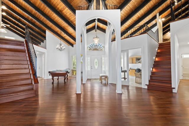 foyer with beamed ceiling, dark wood-type flooring, wood ceiling, and high vaulted ceiling