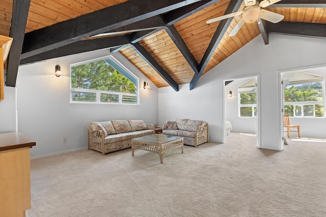 living room featuring beam ceiling, carpet, wooden ceiling, and plenty of natural light