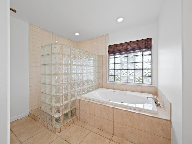 bathroom featuring tile patterned flooring and plus walk in shower