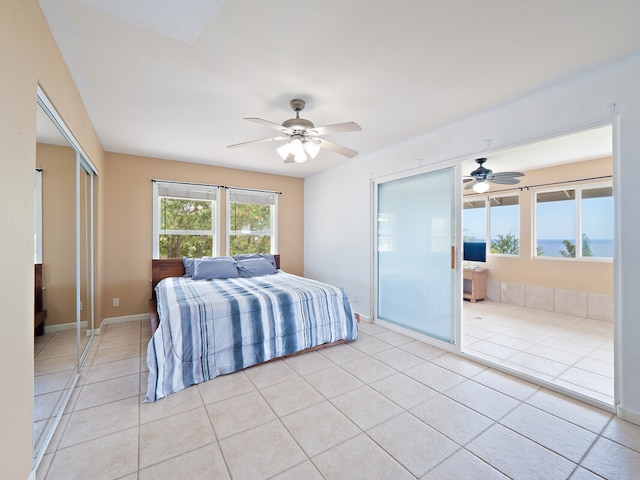 tiled bedroom with ceiling fan