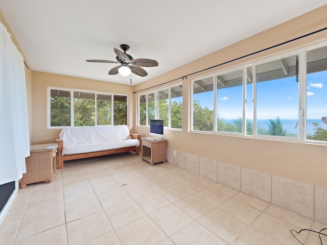 unfurnished bedroom featuring ceiling fan and light tile patterned floors