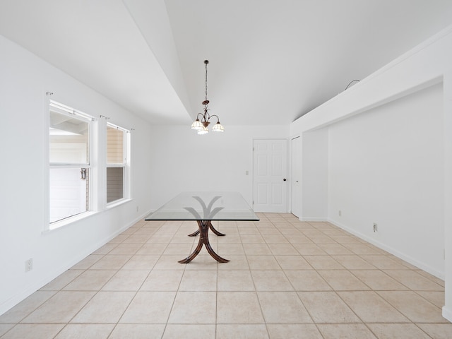 unfurnished dining area featuring light tile patterned flooring, vaulted ceiling, and a chandelier