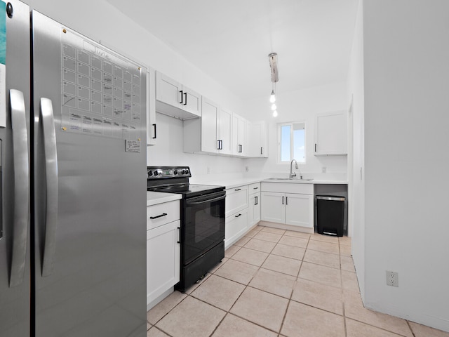 kitchen featuring stainless steel fridge, sink, white cabinets, black electric range oven, and light tile patterned floors