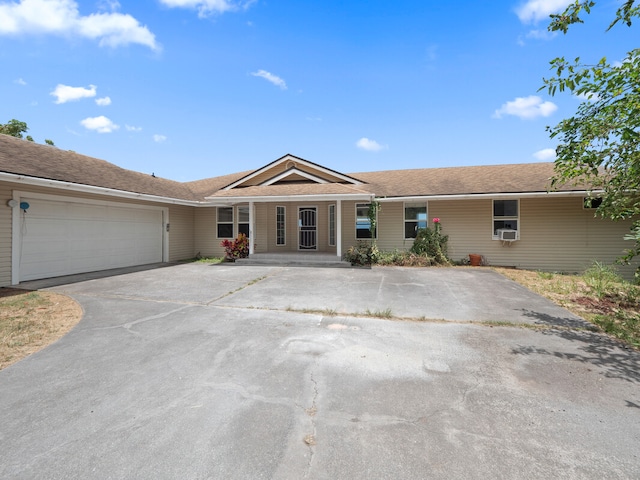 ranch-style house featuring a garage