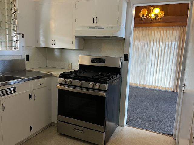 kitchen featuring white cabinets