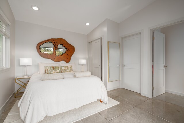 bedroom featuring lofted ceiling