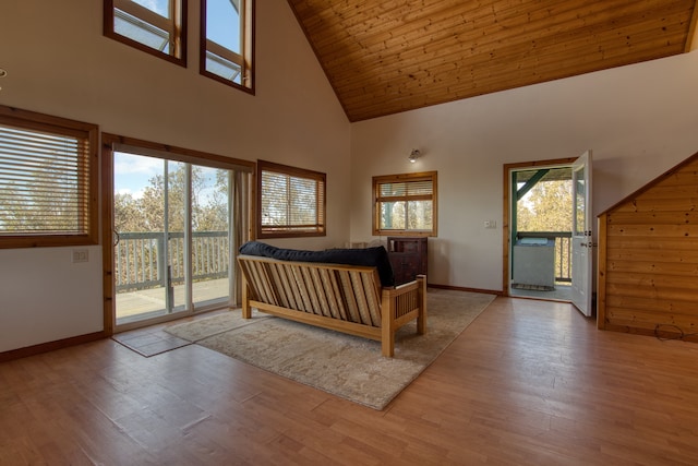 bedroom with wood ceiling, high vaulted ceiling, light hardwood / wood-style flooring, and access to exterior