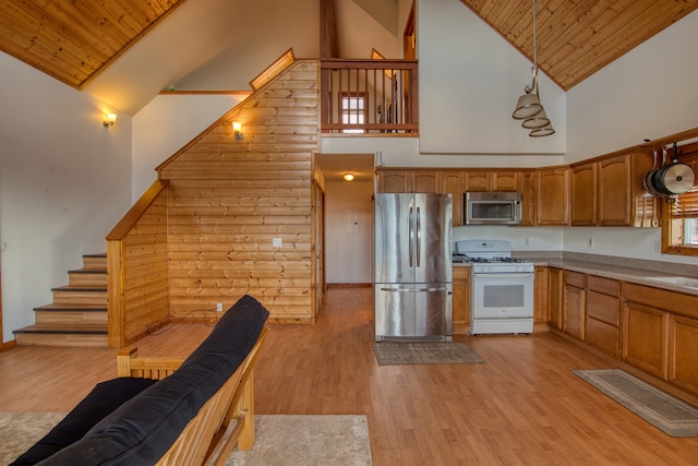 kitchen featuring high vaulted ceiling, stainless steel appliances, wooden ceiling, and light hardwood / wood-style floors