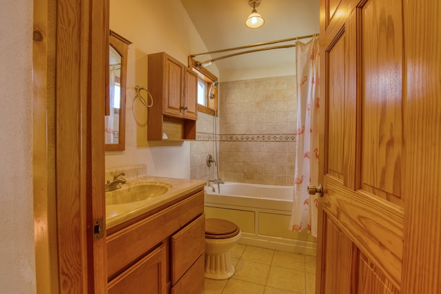 full bathroom featuring toilet, tile patterned floors, shower / bath combo with shower curtain, lofted ceiling, and vanity