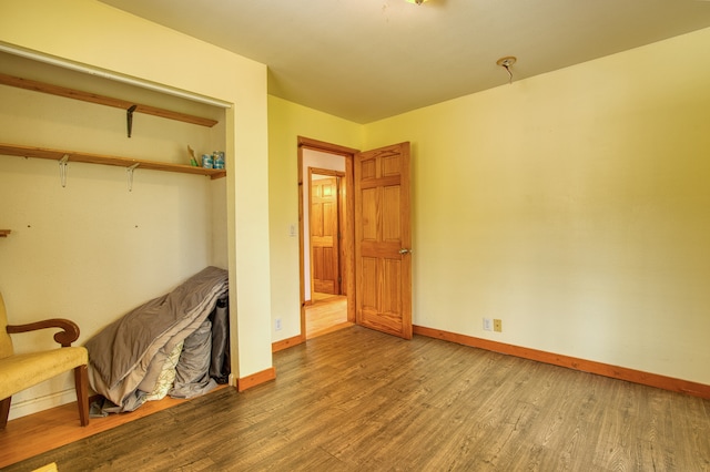 bedroom with hardwood / wood-style floors