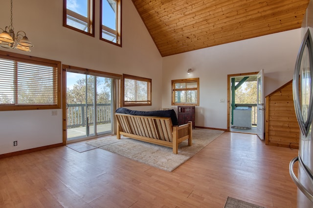 unfurnished bedroom with stainless steel fridge, an inviting chandelier, access to exterior, high vaulted ceiling, and light hardwood / wood-style floors