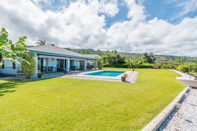 view of swimming pool with a patio area and a lawn