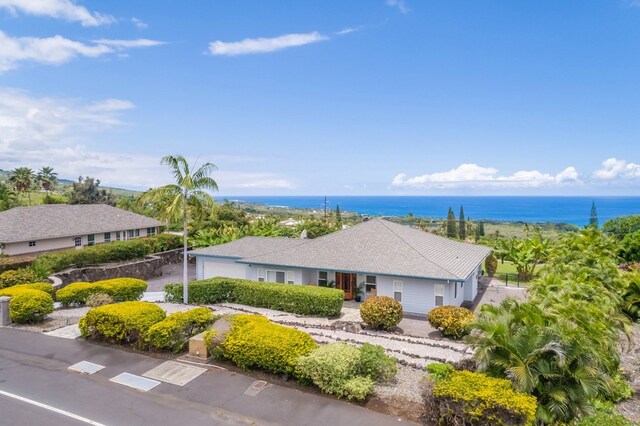 view of front of property featuring a water view