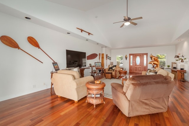 living room with high vaulted ceiling, wood-type flooring, and ceiling fan