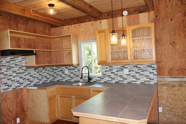 kitchen featuring tasteful backsplash, light brown cabinetry, sink, beamed ceiling, and pendant lighting