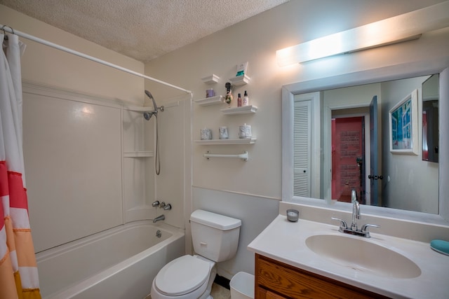 full bathroom with vanity, shower / bath combo, a textured ceiling, and toilet