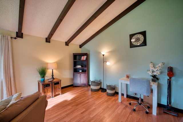 office space with beam ceiling, high vaulted ceiling, and hardwood / wood-style floors