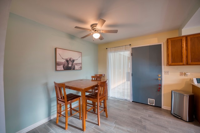 dining area featuring light hardwood / wood-style flooring and ceiling fan