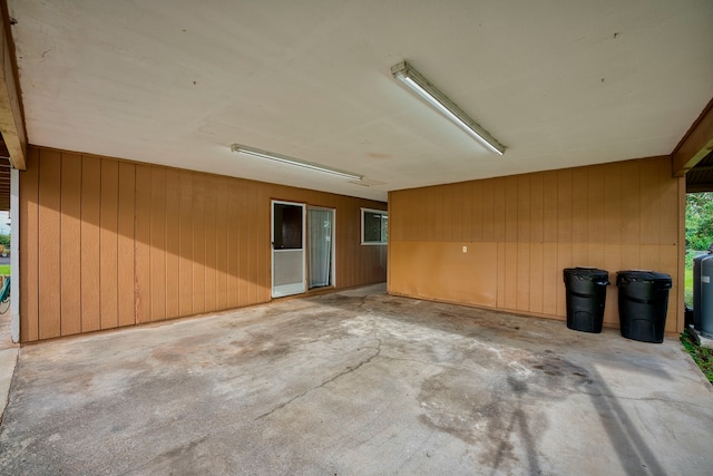 garage featuring wood walls