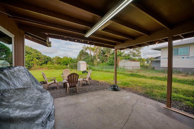 view of patio featuring a shed