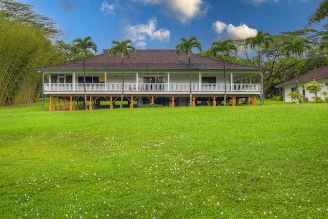 rear view of house with a lawn