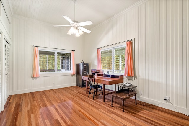 office with crown molding, ceiling fan, light wood-type flooring, and a wealth of natural light