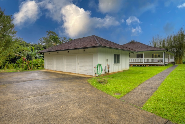 view of property exterior with a garage and a lawn