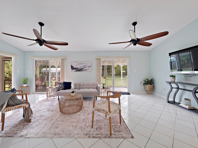 living room with light tile patterned flooring and vaulted ceiling