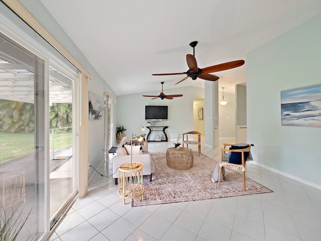 tiled living room featuring vaulted ceiling and ceiling fan