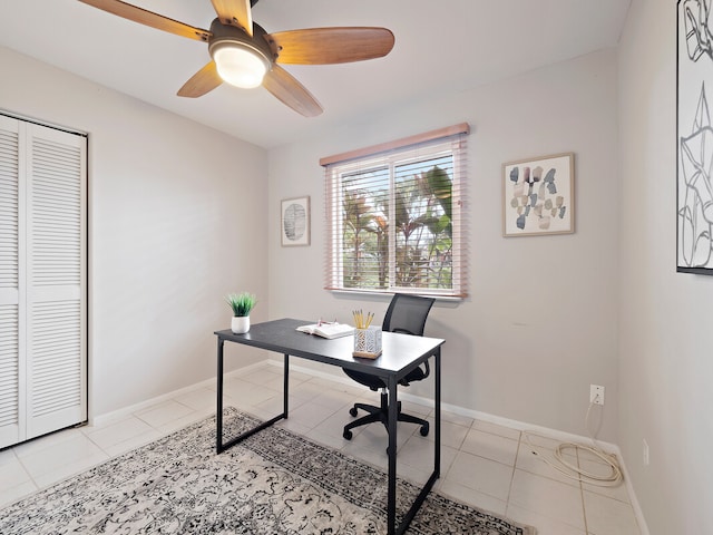 home office with ceiling fan and light tile patterned floors