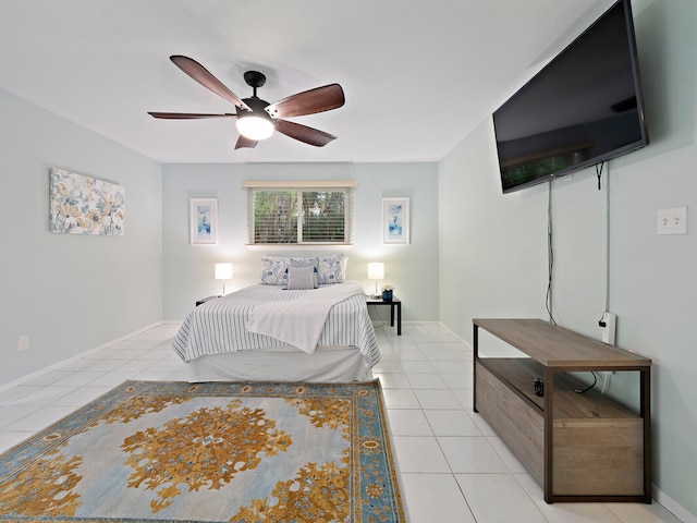 tiled bedroom featuring ceiling fan