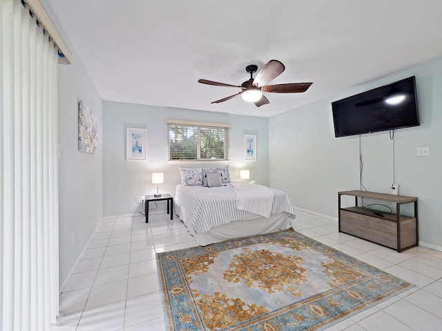 bedroom with ceiling fan and light tile patterned floors