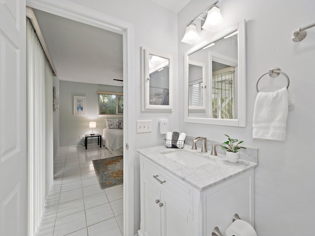 bathroom with tile patterned flooring and vanity