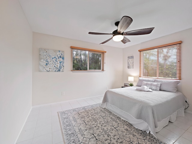 tiled bedroom with ceiling fan