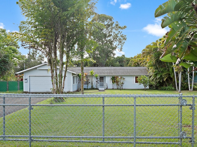 ranch-style home featuring a garage and a front lawn