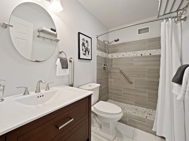 bathroom featuring tile patterned flooring, vanity, a shower with shower curtain, and toilet