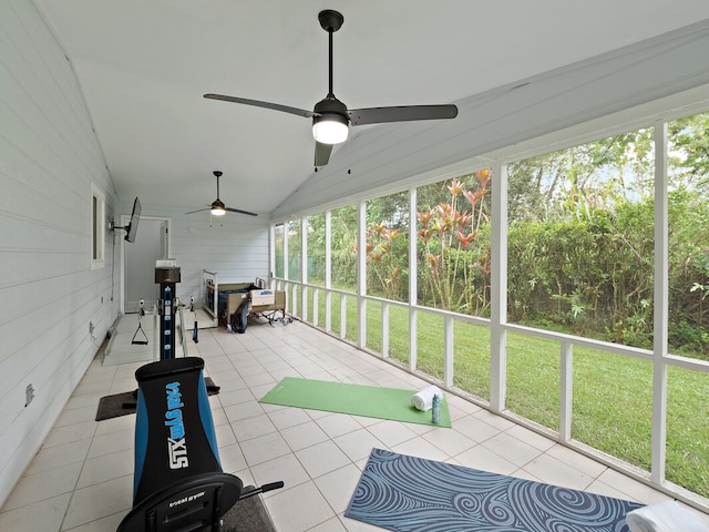 unfurnished sunroom with ceiling fan and lofted ceiling