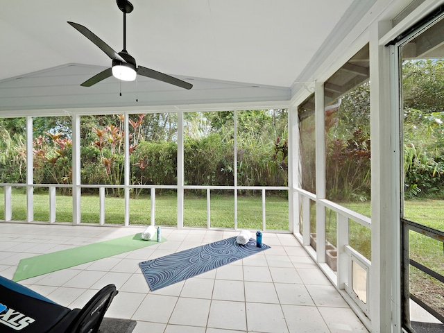 unfurnished sunroom with vaulted ceiling and ceiling fan