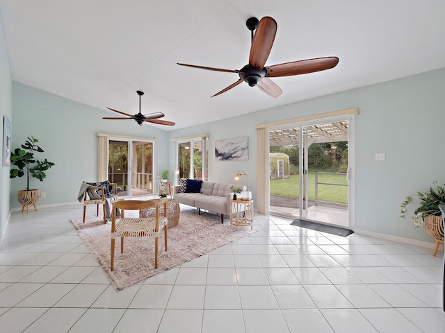 living room featuring ceiling fan, light tile patterned floors, and french doors