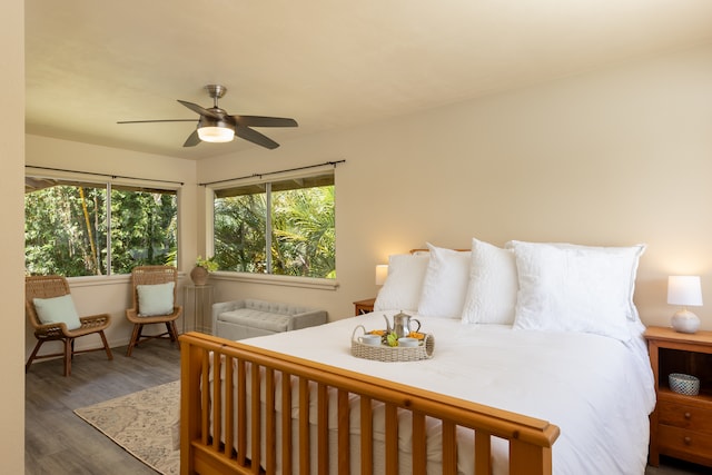 bedroom featuring dark hardwood / wood-style floors and ceiling fan