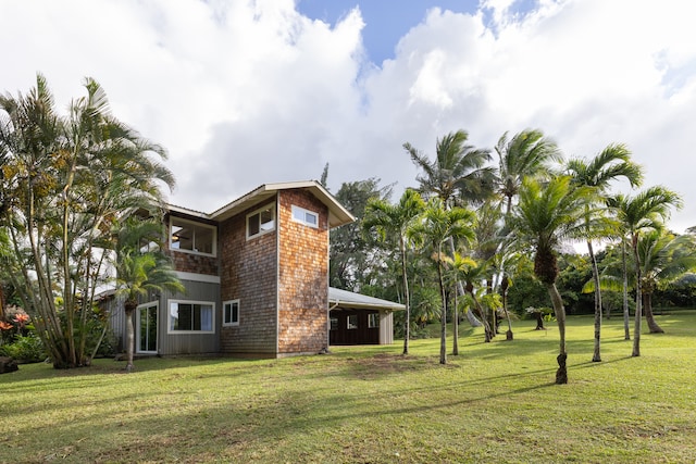 view of home's exterior with a yard