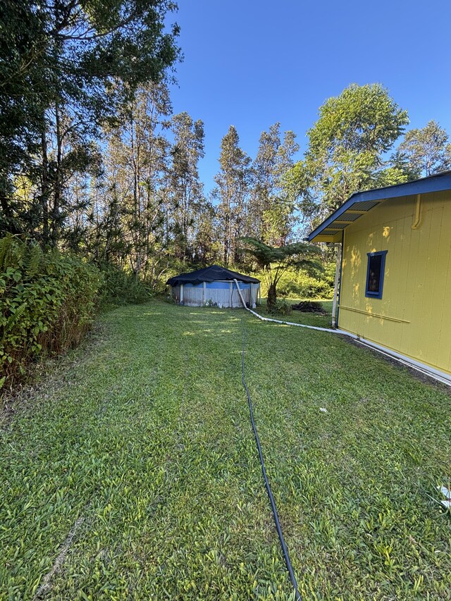 16-1248 Uhini Ana Rd, Mountain View, HI 96771 - view of yard with a covered pool