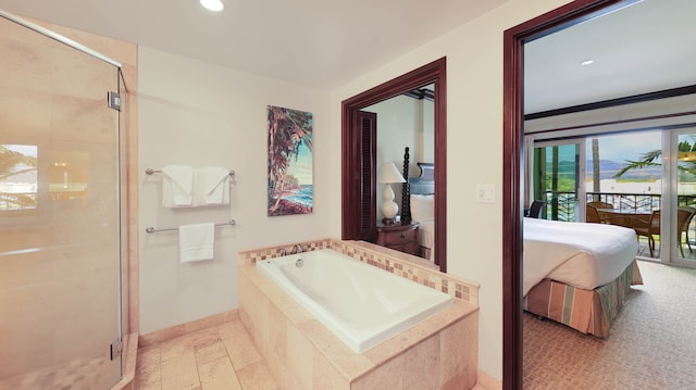 bathroom with separate shower and tub