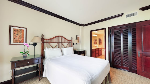 carpeted bedroom featuring ensuite bathroom and crown molding