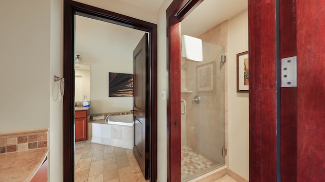 bathroom with vanity and plus walk in shower