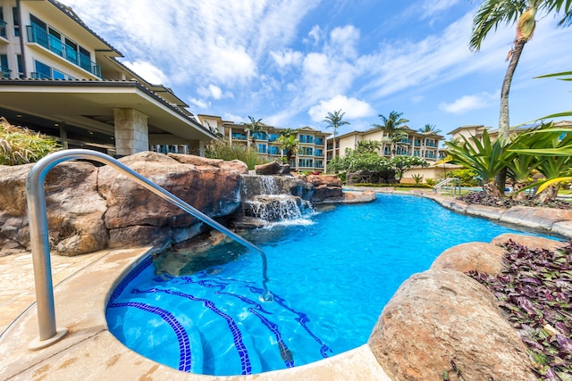 view of pool with pool water feature